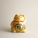 Gato de la suerte japonés dorado maneki neko