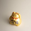 Gato de la suerte japonés dorado maneki neko